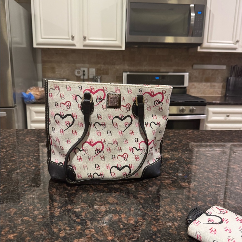 Dooney and bourke purse with matching wallet.